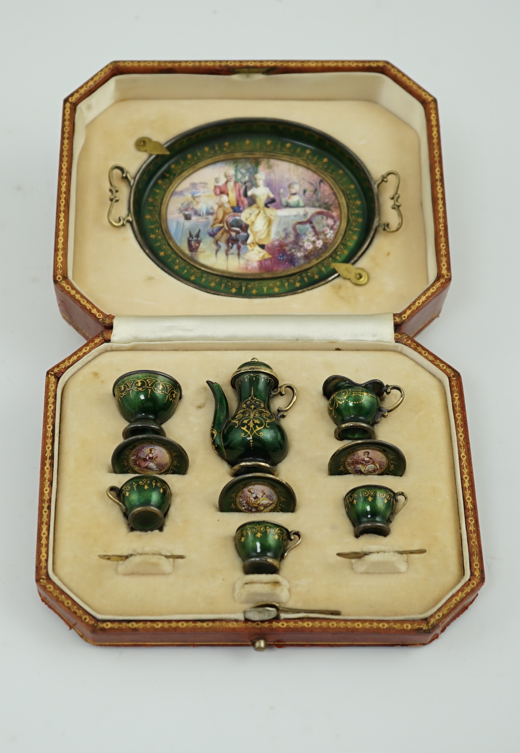 A cased late 19th century Viennese silver and polychrome enamelled miniature thirteen piece tea service, by Ludwig Politzer